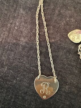 Sterling silver and diamond heart necklace.